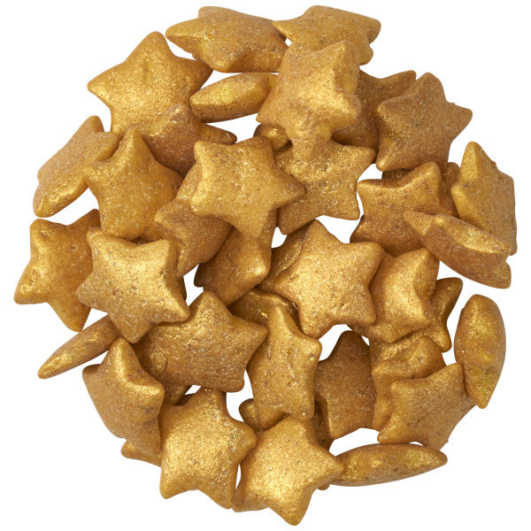 Pile of metallic gold star-shaped quin sprinkles with a softly textured, shimmering finish, shown against a white background.