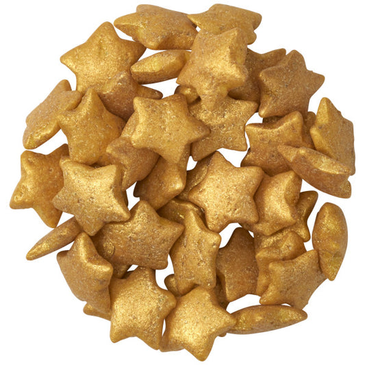Pile of metallic gold star-shaped quin sprinkles with a softly textured, shimmering finish, shown against a white background.