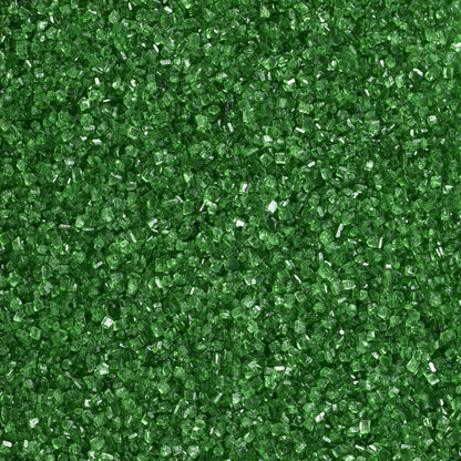 Close-up texture of dark green sanding sugar showing coarse, translucent green sugar crystals with sparkling, faceted surfaces.
