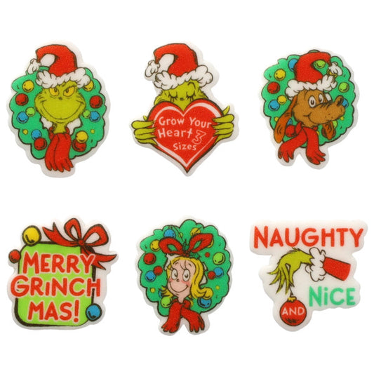 Assorted Grinch themed pressed sugar decorations on a white background, including character wreath designs, a red heart reading “Grow Your Heart 3 Sizes,” a “Merry Grinchmas” present, and a “Naughty and Nice” sign in red and green.