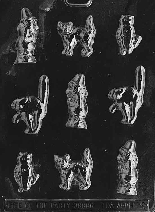 Assorted Halloween mold with pumpkins, ghosts, and festive mini shapes for chocolate or candy making.