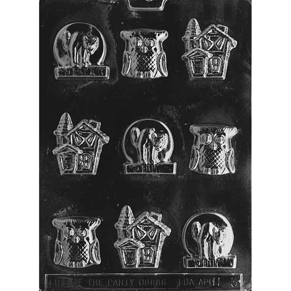 Clear Halloween chocolate mold with nine detailed cavities featuring wide-eyed owls, crooked haunted houses, and black cats posed beneath crescent moons.