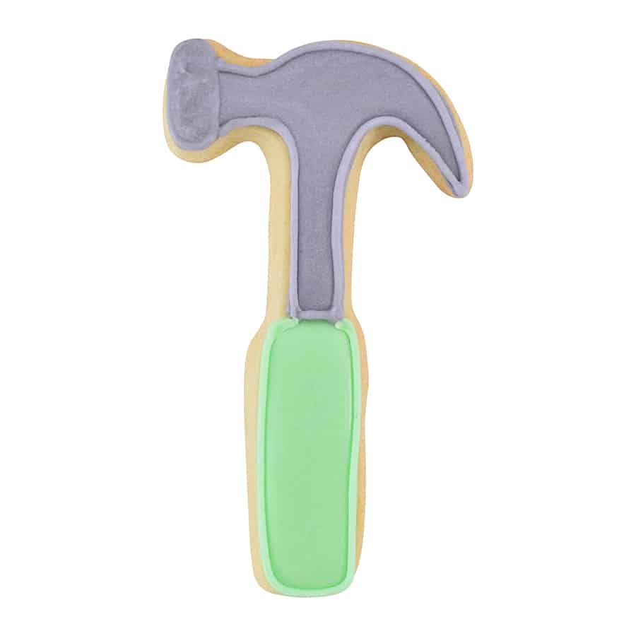 Decorated hammer-shaped cookie with grey icing for the head and green icing for the handle.