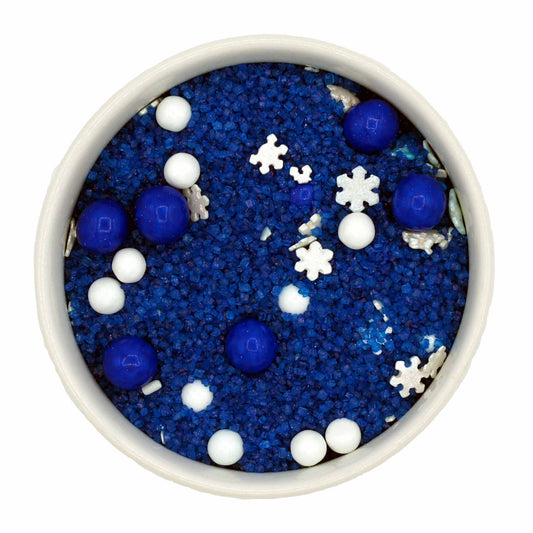 A vibrant mix of deep blue, white, and silver sprinkles with snowflake quins, sugar pearls, and metallic blue Sixlets, perfect for Hanukkah-themed desserts.