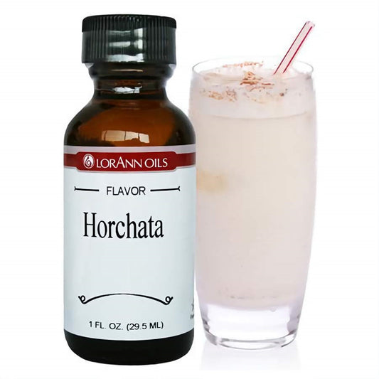 LorAnn Oils Super Strength Horchata Flavor in a 1 fl oz bottle, next to a glass of creamy horchata with a sprinkle of cinnamon, suggesting a sweet rice and cinnamon taste.