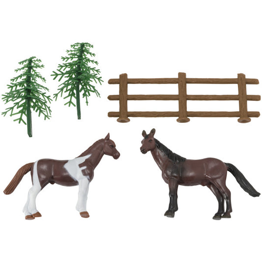 Horses cake topper set showing two plastic horse figurines, two trees, and a brown plastic fence.