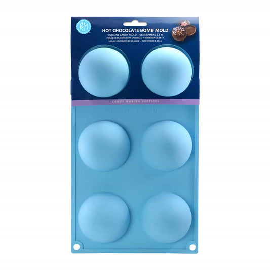 Image of a blue silicone mold designed for making hot chocolate bombs, displayed in its packaging. The mold features six cavities, each shaped as a semi-sphere with a diameter of 2.5 inches. The packaging includes a label with the product name and a picture of a completed hot chocolate bomb, showing the potential result of using this mold.
