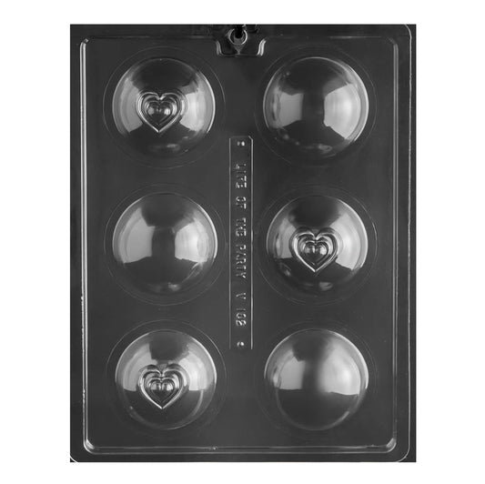 Image of a six-cavity chocolate mold for creating hot cocoa bombs, featuring a unique heart design on top of each semi-spherical mold. The clear, detailed mold allows for intricate heart patterns to be embossed on the chocolate, perfect for a loving, homemade touch to your hot cocoa treats.