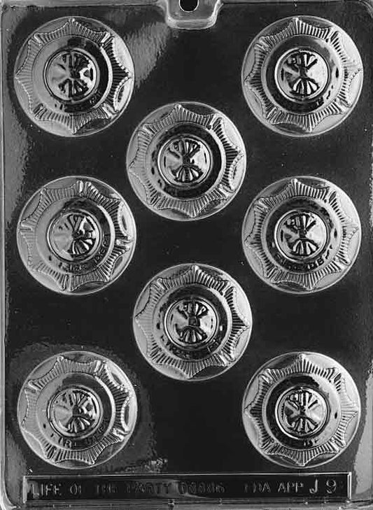 Image shows FIREMAN’S BADGE mold with a large round badge featuring raised emblem details.