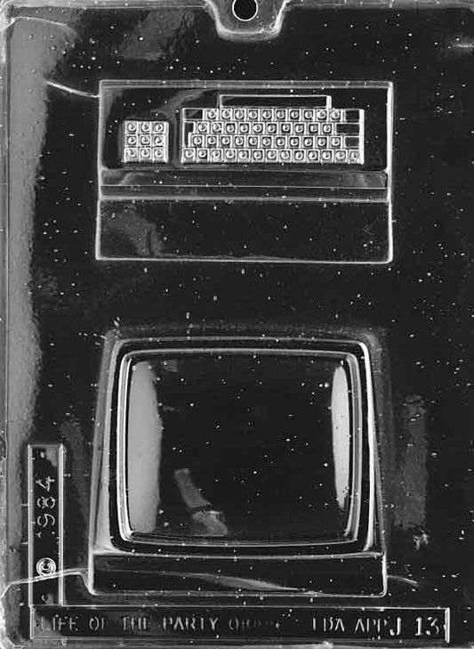 Image shows COMPUTER mold with 3D chocolate computer parts including monitor, base, and tower sections.