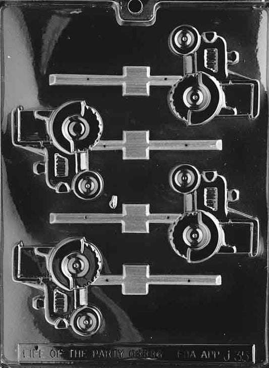 Image shows TRACTOR Lollipop mold with chocolate cavity shaped like a compact farm tractor.