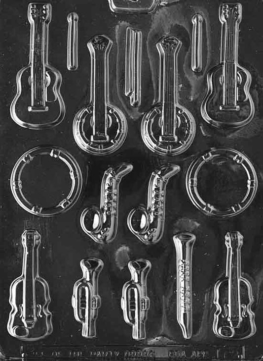 Image of MUSICAL INSTRUMENTS mold with small instrument shapes like trumpet and guitar.