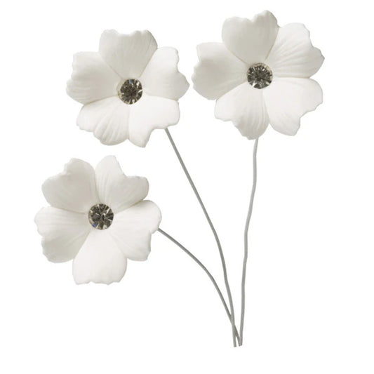 Three white five-petal gum paste flowers on thin gray wires, each with a round silver diamante jewel center, shown on a white background.