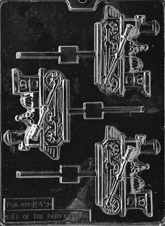 Image of K049 chocolate mold with train engine-shaped Lollipop cavities, featuring smokestack and wheel detailing.