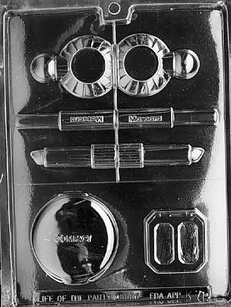 Image of K071 mold showing multiple makeup-themed chocolate cavities like compacts and puffs with cosmetic styling.