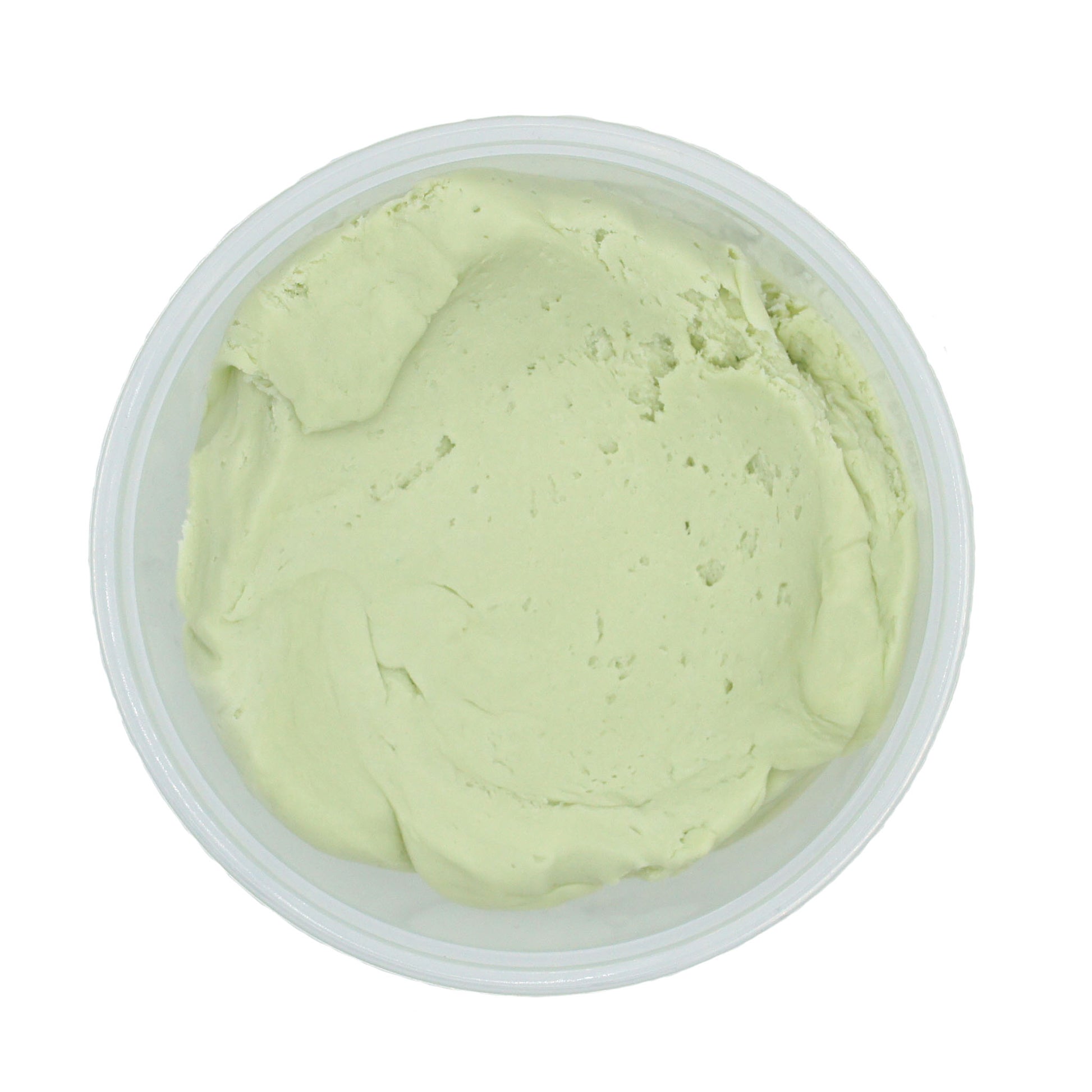 Top-down view of a smooth, creamy key lime candy center in a clear plastic container.