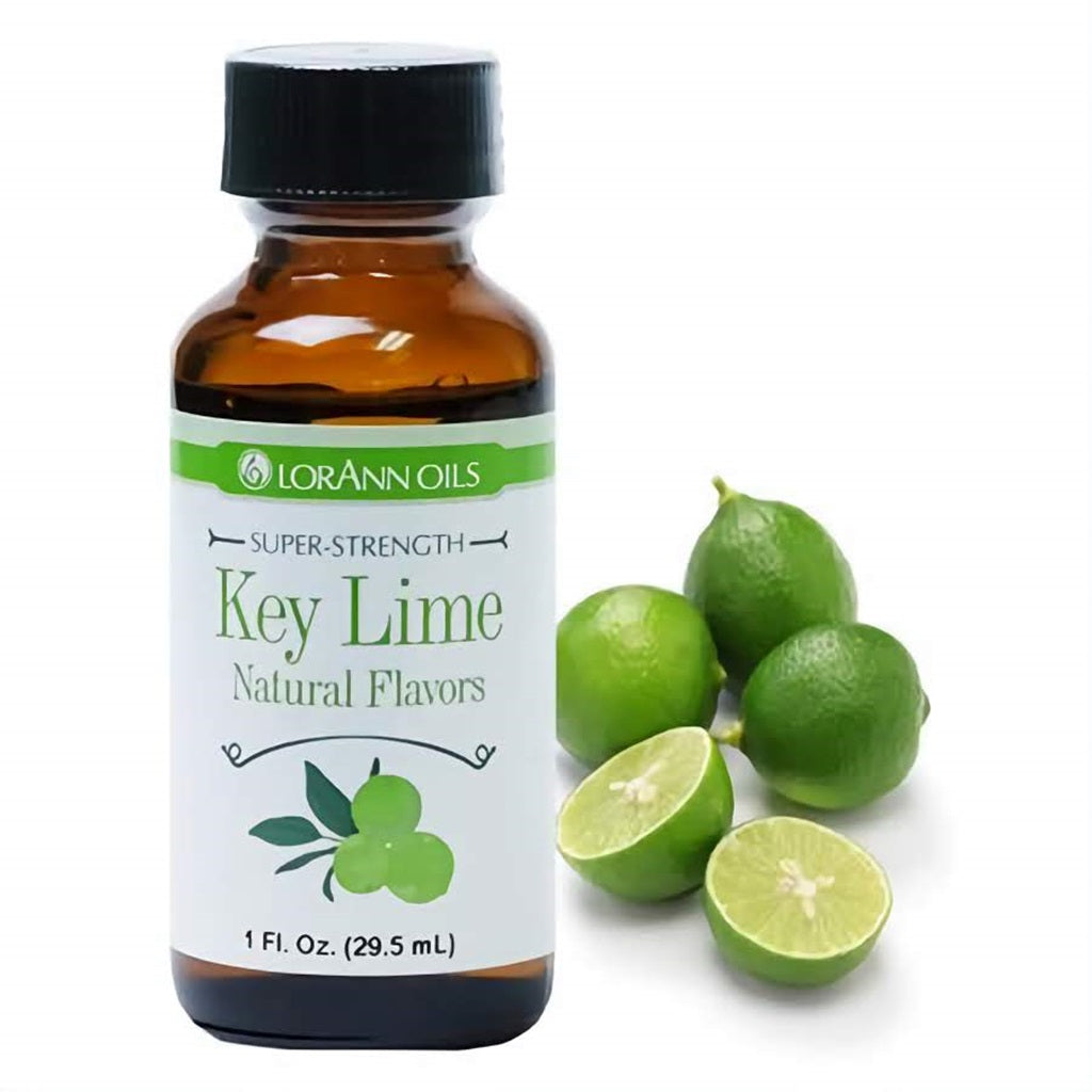 LorAnn Oils Super Strength Key Lime Natural Flavors in a 1 fl oz bottle, accompanied by fresh key limes, conveying a tart and zesty citrus flavor.