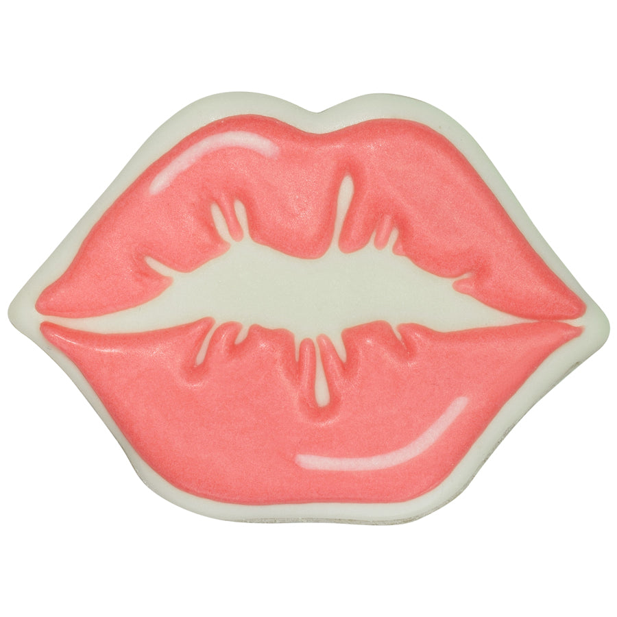 Decorated kissing lips cookie with soft pink icing, white outline, and curved white highlight accents on a white background.