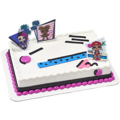 Rectangular white birthday cake decorated with three colorful L.O.L. Surprise!™ Born to Sparkle character picks, bright pink and blue accents, black piping, and retro geometric details.