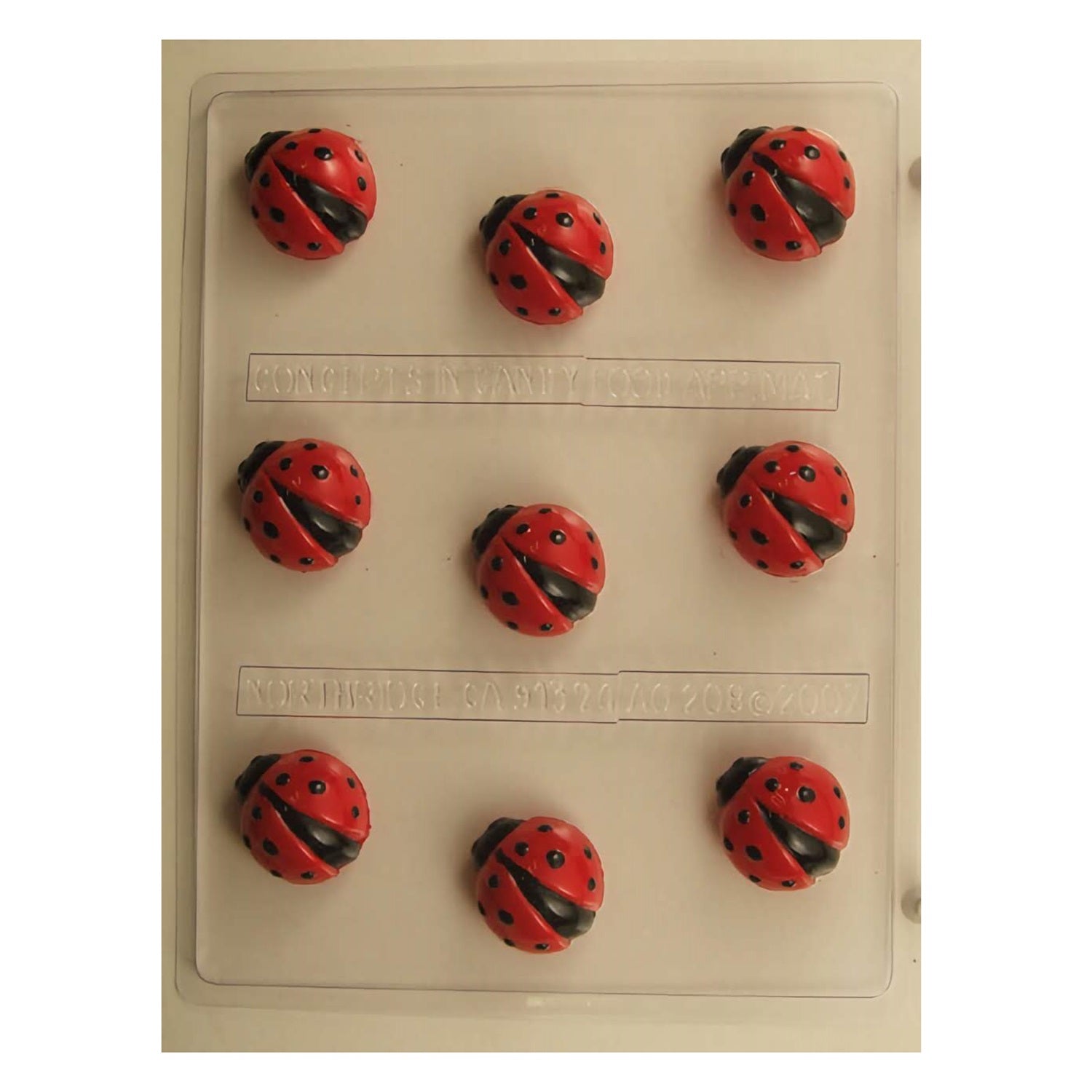 A detailed chocolate mold designed to create realistic ladybug truffles, featuring the iconic red and black spotted shell, suitable for garden parties or as a springtime confectionery delight.