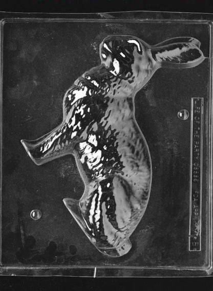 Clear plastic chocolate mold showing the matching back half of a large bunny figure cavity with rounded contours, designed to pair with the front half for a complete 3D chocolate bunny.