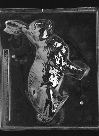 Clear plastic chocolate mold showing the front half of a large bunny figure in profile with raised fur texture and defined ears, designed for a 3D chocolate bunny.