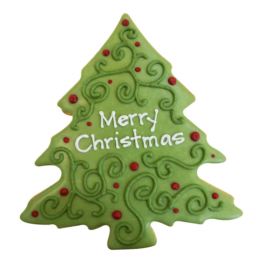 Decorated Christmas tree cookie with green icing, red dots, and 'Merry Christmas' written in white.