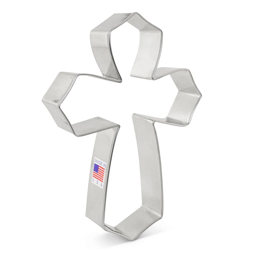 Metal cross-shaped cookie cutter with clean edges and a Made in USA label.