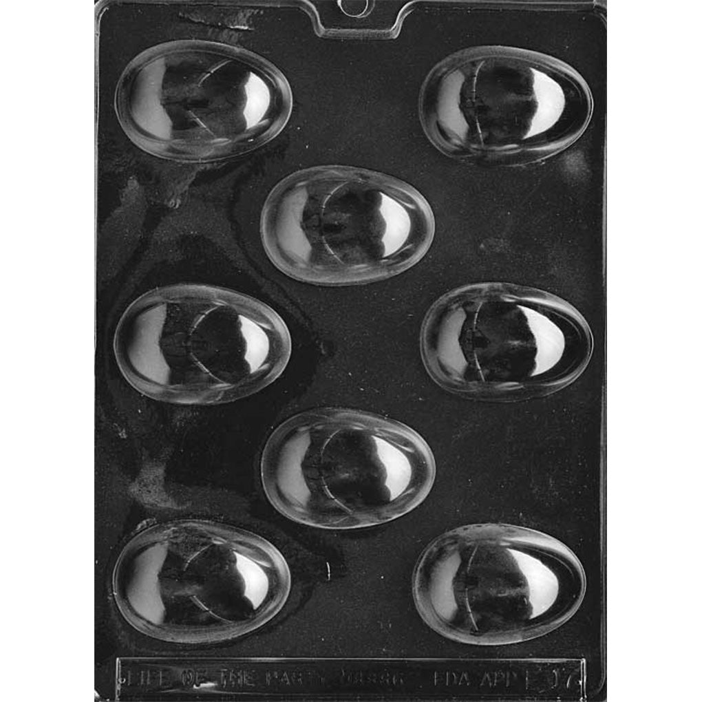 Clear plastic large egg chocolate mold shown on a black background with eight oversized smooth oval egg cavities arranged in a staggered pattern.