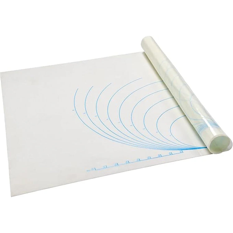 Large white silicone work mat shown partially rolled, with blue concentric measurement arcs and ruler markings printed along the edge.