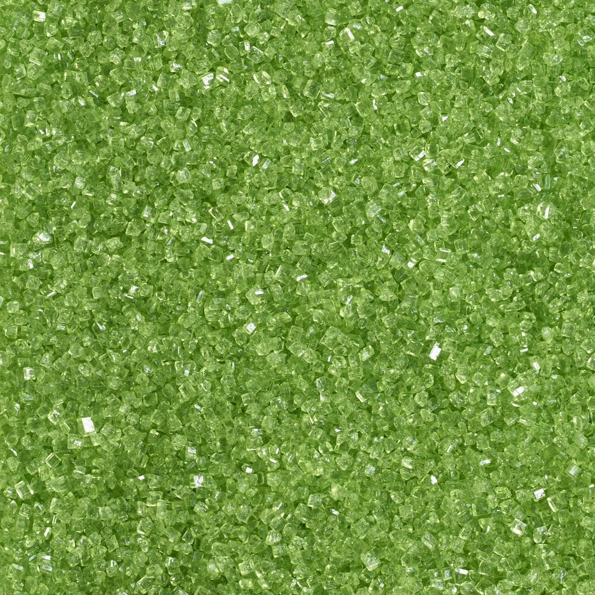 Close-up of bright lime green sanding sugar showing coarse, translucent green sugar crystals with a sparkling, faceted texture.