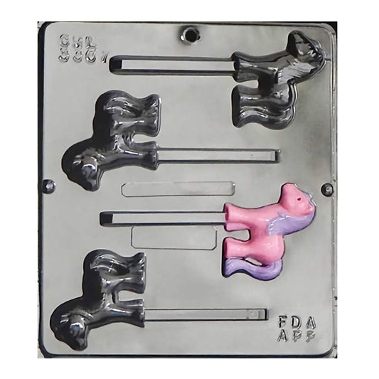 Clear 4-cavity lollipop mold with small pony shapes, each with a flowing mane and tail; one sample pop shown painted pink and purple, stick channels visible.