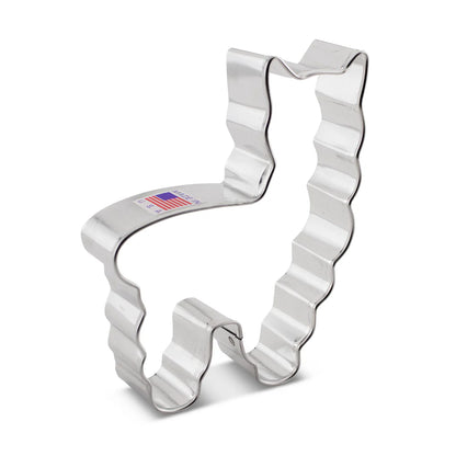 Metal llama-shaped cookie cutter with fluted edges, perfect for creating fun and textured cookies.