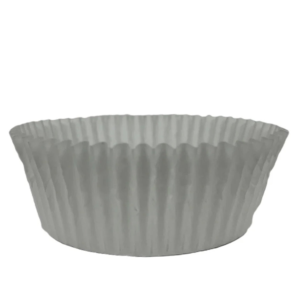 White low wall baking cup with fluted sides and a wide round base, shown on a white background.