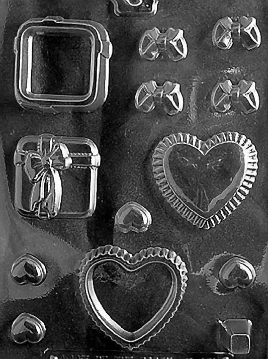 Chocolate mold M186 Heart Present Pour Box with heart and present-shaped cavity designs.