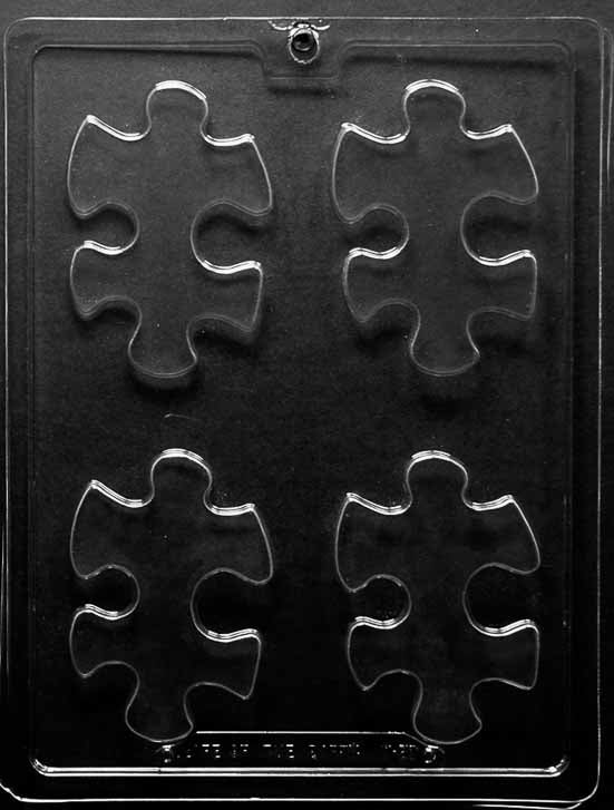 Chocolate mold M219 Puzzle Pieces with rectangular puzzle-shaped cavities featuring interlocking tabs.