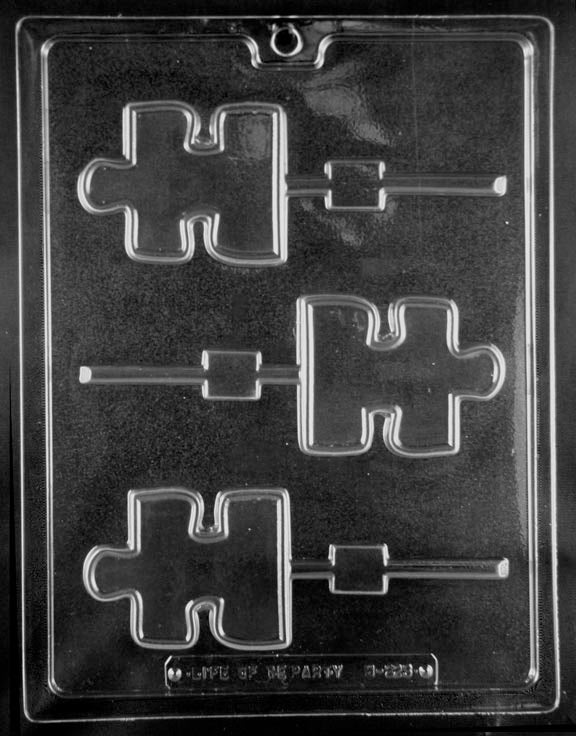 Chocolate mold M223 Puzzle Piece Lollipop with puzzle-shaped pop cavities for awareness-themed chocolates.