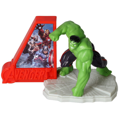 Hulk cake topper with green Hulk figure on a gray textured base next to a red Avengers sign featuring Marvel characters, photographed on a white background.