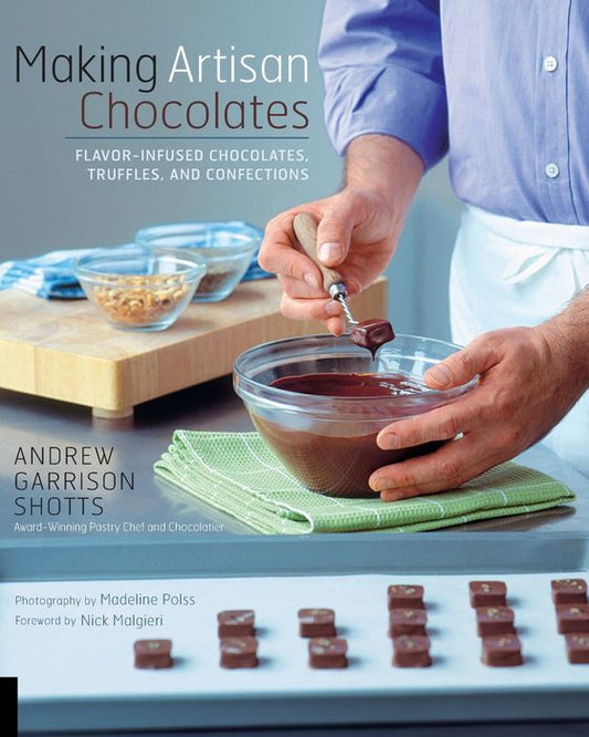 Cover of Making Artisan Chocolates by Andrew Garrison Shotts, featuring a chocolatier dipping a confection into melted chocolate.