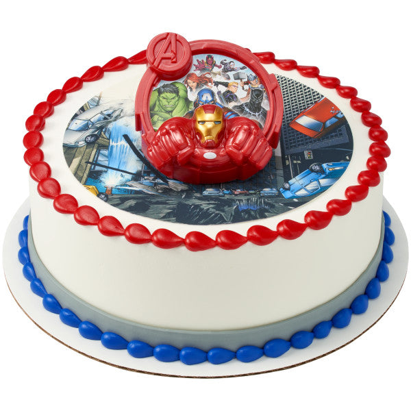 A round cake with an Avengers-themed edible image, bordered with red and blue frosting, and topped with the Avengers-Unify DecoSet cake topper.