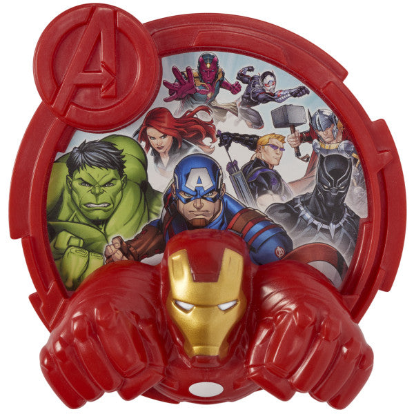 A close-up of the Avengers-Unify DecoSet cake topper featuring a red plaque with Marvel superheroes and an Iron Man knuckle ring with glowing eyes.