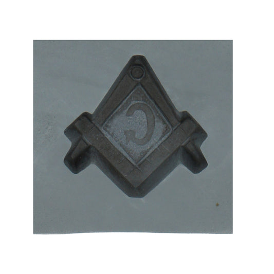 Close-up of a single cavity in the Masonic compass and square rubber mint mold, showcasing the detailed Masonic symbol for candy making.