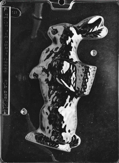 Clear plastic chocolate mold showing the matching half of a bunny carrying a basket on its back, made to pair with the first half for a complete 3D chocolate figure.