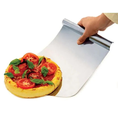 Stainless steel mega lifter sliding under a baked pizza with tomatoes and basil, demonstrating its use for transferring food.