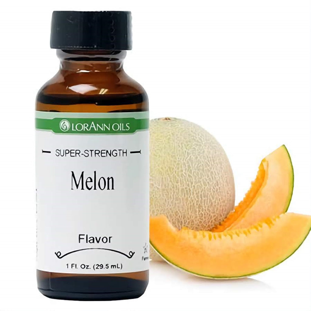 1 fl oz bottle of LorAnn Oils Super Strength Melon Flavor next to a fresh, sliced cantaloupe, hinting at a juicy and ripe melon taste.