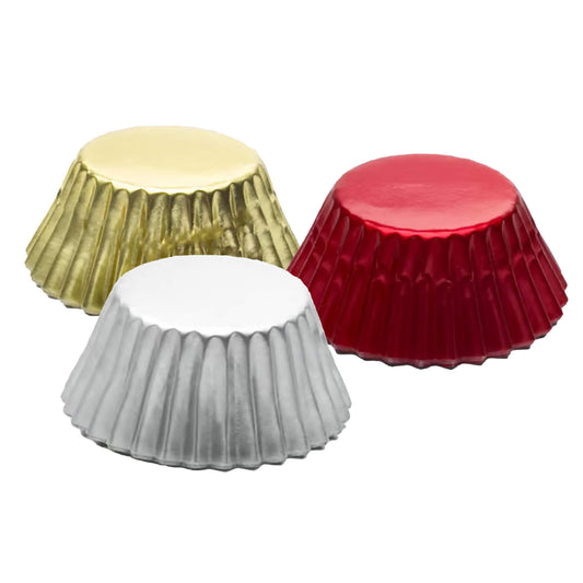 Three mini foil baking cups in gold, red, and silver, grouped together on a white background.