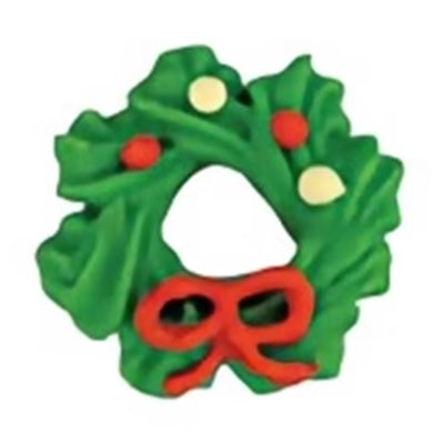 Green Christmas wreath cookie with red bow and red and white candy decorations.