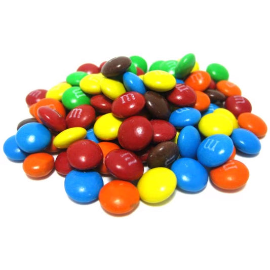 A pile of colorful Mini M&Ms, featuring a mix of red, yellow, green, blue, orange, and brown milk chocolate candies, perfect for baking and decorating.