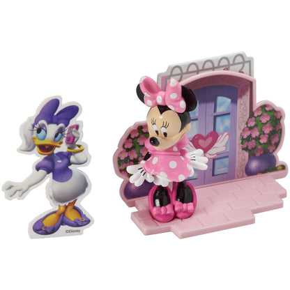 Minnie Mouse cake topper set featuring a Minnie figurine, a decorative background with a door, and a Daisy Duck poly pic.