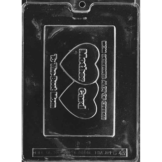 Clear plastic chocolate mold with one large rectangular cavity shaped like a novelty credit card with the message “Mom Deserves A Lot Of Credit” and heart details reading “Mother” and “Card.”